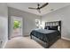 Bedroom featuring neutral walls, ceiling fan, balcony access, and an upholstered headboard at 6418 Bright Bay Ct, Apollo Beach, FL 33572