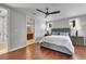 Comfortable main bedroom with hardwood floors and ensuite bathroom at 6418 Bright Bay Ct, Apollo Beach, FL 33572