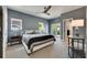 Elegant main bedroom featuring a neutral palette, plush bedding, and access to a private balcony at 6418 Bright Bay Ct, Apollo Beach, FL 33572