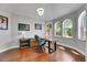 Bright office space with hardwood floors, arched windows, stylish desk, and modern decor at 6418 Bright Bay Ct, Apollo Beach, FL 33572