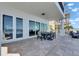 This patio features a stylish outdoor dining set, offering scenic waterfront views for sophisticated outdoor relaxation at 6418 Bright Bay Ct, Apollo Beach, FL 33572