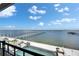 Gorgeous waterfront view from the balcony with a sleek pool and private docks at 6418 Bright Bay Ct, Apollo Beach, FL 33572