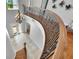 Beautiful staircase with ornate railing leading to the main floor with a view of the entryway at 6418 Bright Bay Ct, Apollo Beach, FL 33572