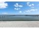 Breathtaking waterfront view with a clear blue sky, showcasing a tranquil ocean with multiple docks stretching into the distance at 6418 Bright Bay Ct, Apollo Beach, FL 33572
