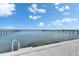 Scenic waterfront view under a clear sky, featuring calm waters and docks, complete with a convenient access ladder at 6418 Bright Bay Ct, Apollo Beach, FL 33572