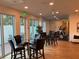Amenity space featuring comfortable seating, a glass table, and an adjacent gym at 644 3Rd S Ave # 402, St Petersburg, FL 33701