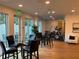 Amenity space featuring comfortable seating, a glass table, and an adjacent gym at 644 3Rd S Ave # 402, St Petersburg, FL 33701