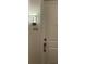 Apartment door with unit number 402 and modern light fixture at 644 3Rd S Ave # 402, St Petersburg, FL 33701