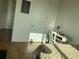 Cozy bedroom featuring hardwood floors, a desk, and a comfortable bed with natural light at 644 3Rd S Ave # 402, St Petersburg, FL 33701