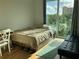 Bright bedroom featuring a large window with views and modern furniture at 644 3Rd S Ave # 402, St Petersburg, FL 33701