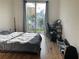 Bright bedroom featuring a large window with scenic views and a cozy workspace at 644 3Rd S Ave # 402, St Petersburg, FL 33701