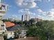 Expansive city view featuring buildings, rooftops, and trees under a partly cloudy sky at 644 3Rd S Ave # 402, St Petersburg, FL 33701