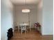 Cozy dining area features natural light and hardwood flooring at 644 3Rd S Ave # 402, St Petersburg, FL 33701