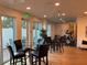 Gym with modern fitness equipment, tables, and chairs at 644 3Rd S Ave # 402, St Petersburg, FL 33701