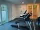 Gym with modern fitness equipment, a mirror, and a view of the outside at 644 3Rd S Ave # 402, St Petersburg, FL 33701