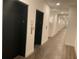 Well-lit hallway with elevator doors, neutral walls, and modern flooring at 644 3Rd S Ave # 402, St Petersburg, FL 33701