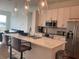 Modern kitchen featuring a large island with seating, stainless steel appliances, and pendant lighting at 644 3Rd S Ave # 402, St Petersburg, FL 33701