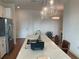 Kitchen island with a sink, modern faucet, and sleek countertop at 644 3Rd S Ave # 402, St Petersburg, FL 33701