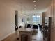 Open-concept kitchen features an island with pendant lighting and stainless steel appliances at 644 3Rd S Ave # 402, St Petersburg, FL 33701