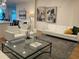 Open-concept living area with modern decor, stylish seating, and plenty of natural light at 644 3Rd S Ave # 402, St Petersburg, FL 33701