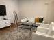 Stylish living room featuring white sofas, glass coffee table, sleek white TV console, and modern decor at 644 3Rd S Ave # 402, St Petersburg, FL 33701