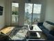 Bright living room with hardwood floors and access to a balcony at 644 3Rd S Ave # 402, St Petersburg, FL 33701