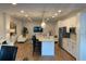 Open living space featuring a modern kitchen, comfortable seating, and a large TV for entertainment at 644 3Rd S Ave # 402, St Petersburg, FL 33701