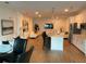 Open concept living space with kitchen island, modern furnishings, and hardwood floors at 644 3Rd S Ave # 402, St Petersburg, FL 33701