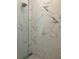 Sleek shower showcasing marble-patterned tiles and a modern glass enclosure at 644 3Rd S Ave # 402, St Petersburg, FL 33701