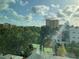 Bright view from the unit's window showcasing neighborhood greenery and buildings at 644 3Rd S Ave # 402, St Petersburg, FL 33701