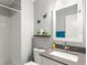 Bathroom featuring neutral gray walls, a shower, and a sink with ample counter space at 6681 121St Ave # I, Largo, FL 33773