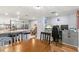 Open floor plan with a kitchen, dining area, and desk space with natural light at 6681 121St Ave # I, Largo, FL 33773