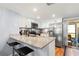 Eat-in kitchen with granite countertops, stainless steel appliances, and backyard access at 6681 121St Ave # I, Largo, FL 33773
