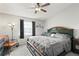 Comfortable main bedroom featuring a ceiling fan, soft lighting, and a relaxing atmosphere at 6681 121St Ave # I, Largo, FL 33773