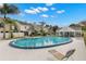 Beautiful community pool with lounge seating and a covered area for relaxing at 6681 121St Ave # I, Largo, FL 33773