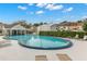 Community pool with lounge chairs and a covered seating area for residents at 6681 121St Ave # I, Largo, FL 33773