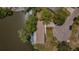 Aerial view of waterfront property showing house layout, cul-de-sac and canal access at 7332 Janczlik Dr, New Port Richey, FL 34652