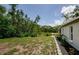 Lush backyard with direct waterfront access, providing a tranquil and private outdoor experience at 7332 Janczlik Dr, New Port Richey, FL 34652