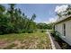 Lush backyard overlooking the canal, complete with greenery and landscaping, providing a serene escape at 7332 Janczlik Dr, New Port Richey, FL 34652
