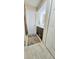 Bathroom features marble-look tile floor, wood vanity with white countertop, and white doors at 7332 Janczlik Dr, New Port Richey, FL 34652