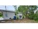 Exterior of the property showing the air conditioner, landscaping, and outdoor features at 7332 Janczlik Dr, New Port Richey, FL 34652