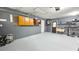View of the spacious garage, showcasing storage shelves, work area, and utility connections at 7332 Janczlik Dr, New Port Richey, FL 34652