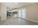 Spacious kitchen with tile floors, white cabinetry, stainless steel appliances and granite countertops at 7332 Janczlik Dr, New Port Richey, FL 34652
