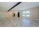Open living space with tile floors, a decorative fireplace, and plenty of natural light at 7332 Janczlik Dr, New Port Richey, FL 34652