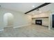 Versatile living room space with archway and a fireplace, offering seamless flow and comfortable living at 7332 Janczlik Dr, New Port Richey, FL 34652