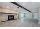 Inviting living room featuring a fireplace, tile floors, and neutral paint, ideal for cozy evenings and gatherings at 7332 Janczlik Dr, New Port Richey, FL 34652