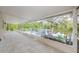 Screened-in porch showcases tile floors and expansive lake views at 7332 Janczlik Dr, New Port Richey, FL 34652
