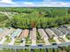 Aerial view of the community with well-maintained homes and lush landscaping at 7606 Berna Ln, Land O Lakes, FL 34637