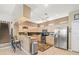 Spacious kitchen with stainless steel appliances and breakfast bar seating at 7606 Berna Ln, Land O Lakes, FL 34637
