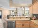 Kitchen with breakfast bar, stainless appliances and large sink at 7606 Berna Ln, Land O Lakes, FL 34637